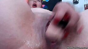 Redhead Camgirl Teases In Three Bras