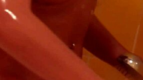 brunette with tattoos has a nice shower