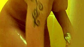 brunette with tattoos has a nice shower