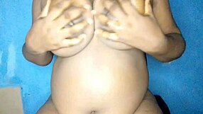 ebony romancing her busty titts