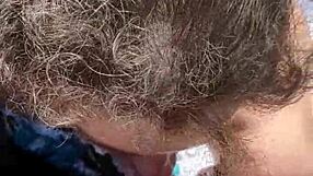 Feeling horny, she gives an outdoor blowjob in public