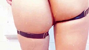 Sultry woman shows ass in fishnet lingerie