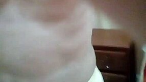 Intense gay masturbation session in a public hotel room.