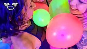 Latina friends playing with balloons in fun session