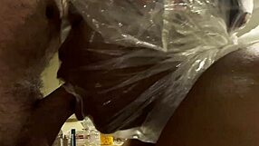 ebony woman with bag on head in spitting scene