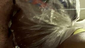 ebony woman with bag on head in spitting scene