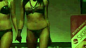 Horny strippers clash on stage for wild public play