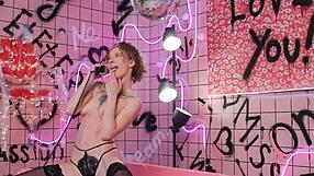 Anita relaxes in a pink trash bath behind the scenes