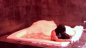 In the jacuzzi, her natural big tits bounce as she rides and moans