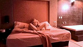 In the jacuzzi, her natural big tits bounce as she rides and moans