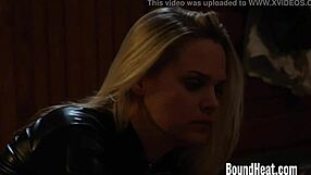 Mistress exclaims, 'feed the slave and check the new girl!' in leather bondage scene.