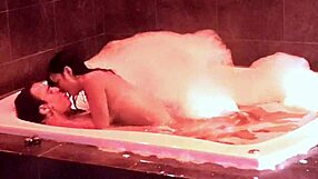 In the jacuzzi, her natural big tits bounce as she rides and moans