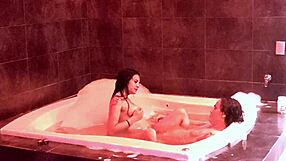 In the jacuzzi, her natural big tits bounce as she rides and moans