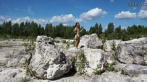 Topless mature lady dances seductively in stone quarry