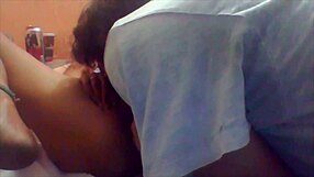 Sarita plays a game while relaxing at home