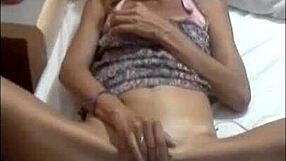 Sarita plays a game while relaxing at home