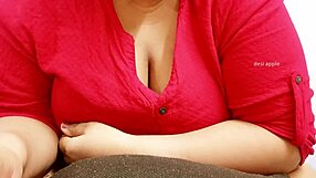 Asian milf squeezes her big boobs.