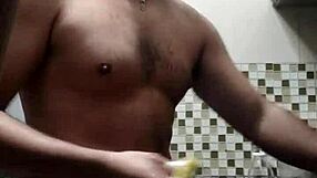 macho guy bent over washing dishes, with a suggestive twist