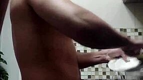 macho guy bent over washing dishes, with a suggestive twist