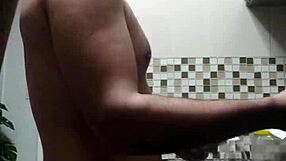 macho guy bent over washing dishes, with a suggestive twist