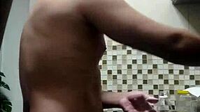 macho guy bent over washing dishes, with a suggestive twist