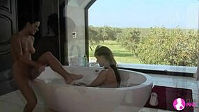 Brunette lesbians lick and finger each other in the bath.