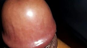Black cock cums during handjob session.