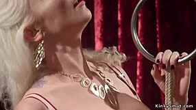 Blonde Dominates Tied-Up Slave with Strapon and Anal Fisting