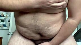 Watch This Horny Gay Guy Masturbating His Hairy Belly And Boobs!