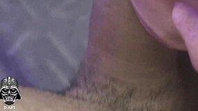 brunette girl holds two cocks and cums