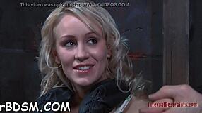 Beautiful tied-up slave endures rough bondage fucking in BDSM scene.