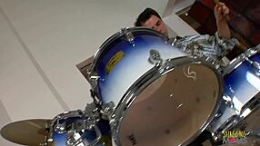 the drummer gets a blowjob from a blonde slut before they fuck passionately.