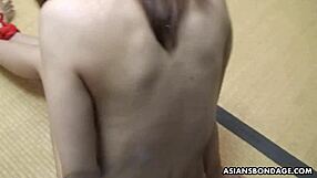 Tight Asian Masochist Toys Her Hairy Cunt While Tied Up and Whipped