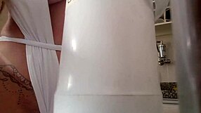 tiffany montavani in the kitchen gets horny and touches her big clit in the bathtub