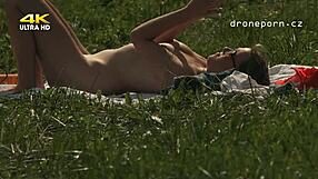 Is this young Czech girl with small tits masturbating outdoors?