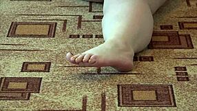 I watch this bbw in pantyhose licking her legs while she masturbates passionately.