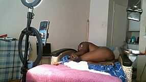 Solo sexy African American MILF with saggy tits.