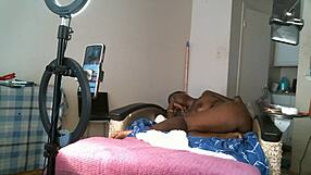 Solo sexy African American MILF with saggy tits.