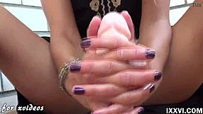 Watch how she works a big dildo with footjob and handjob.