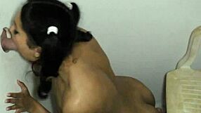 Pigtail beauty sucks cocks through gloryhole, swallowing eagerly