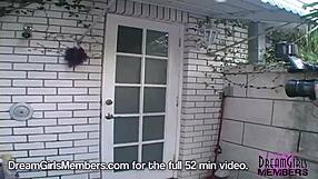 Two tanned brunette hotties with shaved pussies and tan lines get cooled off in the shower, gaping and playing with tits