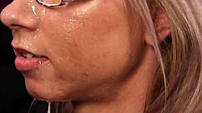 Foxy honey receives a massive jizz load on her face and devours every drop