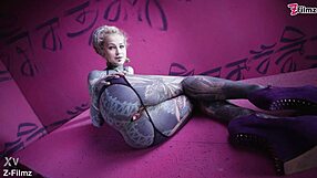 Goth punk hints at anal pleasures with finger and buttplug