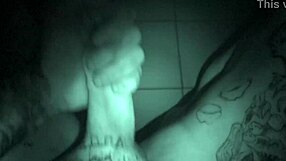 Watch this tattooed guy stroke his cock late at night!