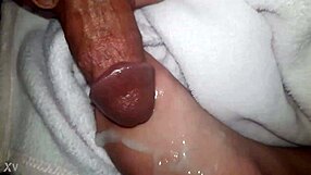 Cumshot Landing on Oiled Feet in Glamorous Scene