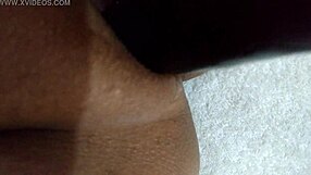 wife playfully using dildo at home