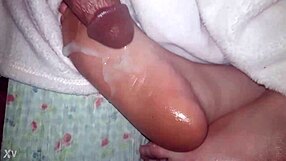 Cumshot Landing on Oiled Feet in Glamorous Scene