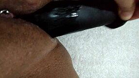 wife playfully using dildo at home