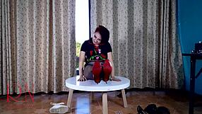 Curvy brunette maid strips in pantyhose at dorm table