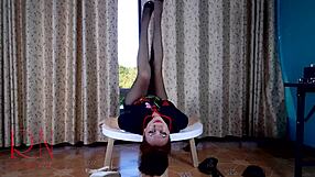 Curvy brunette maid strips in pantyhose at dorm table